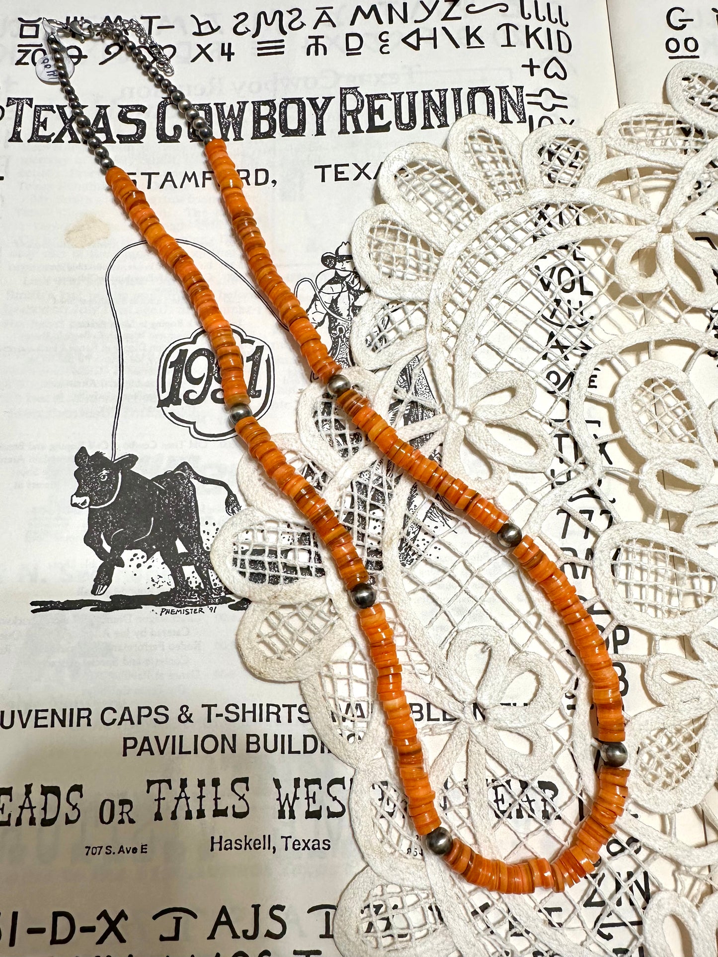 the long orange necklace