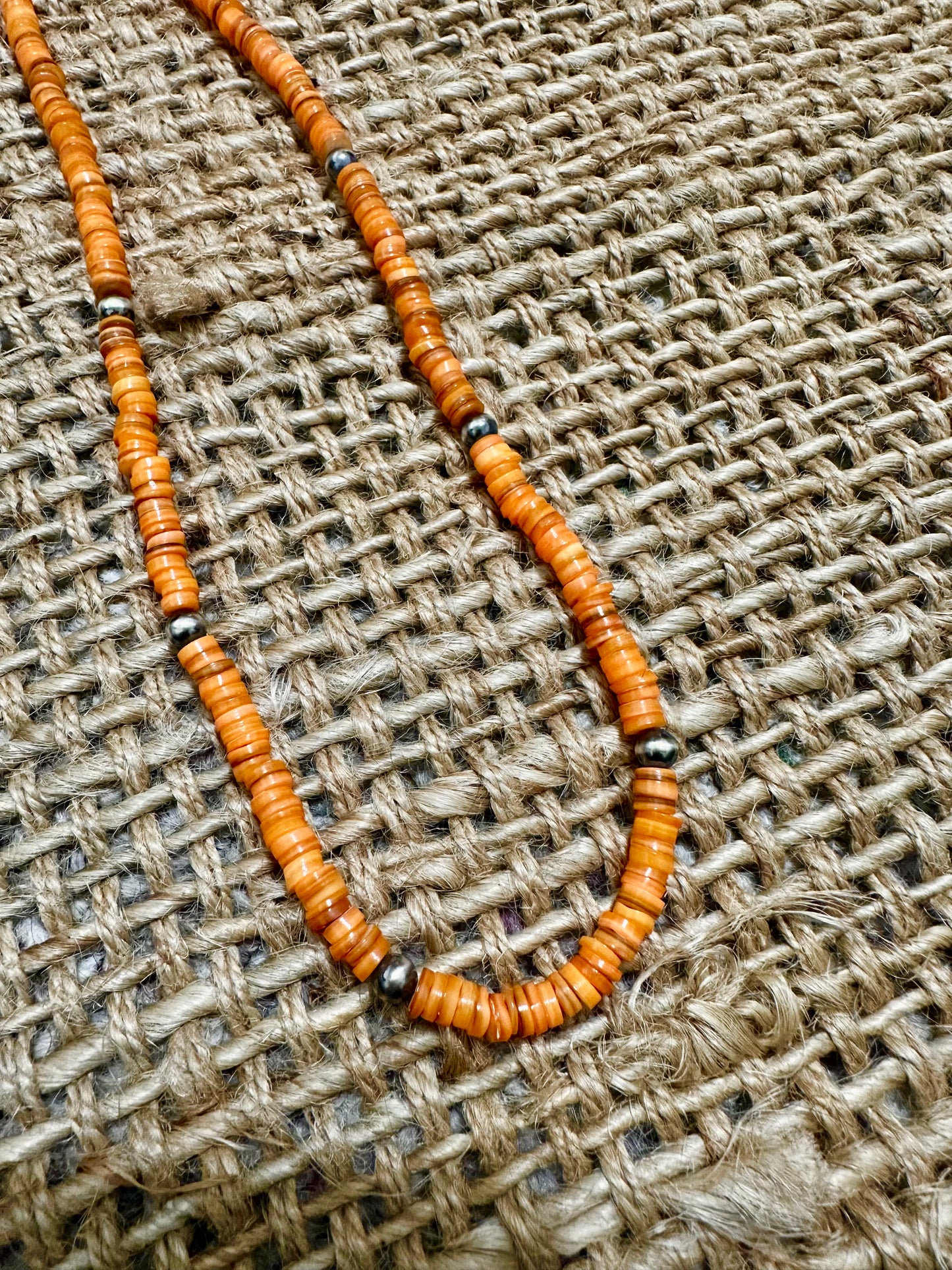 the long orange necklace