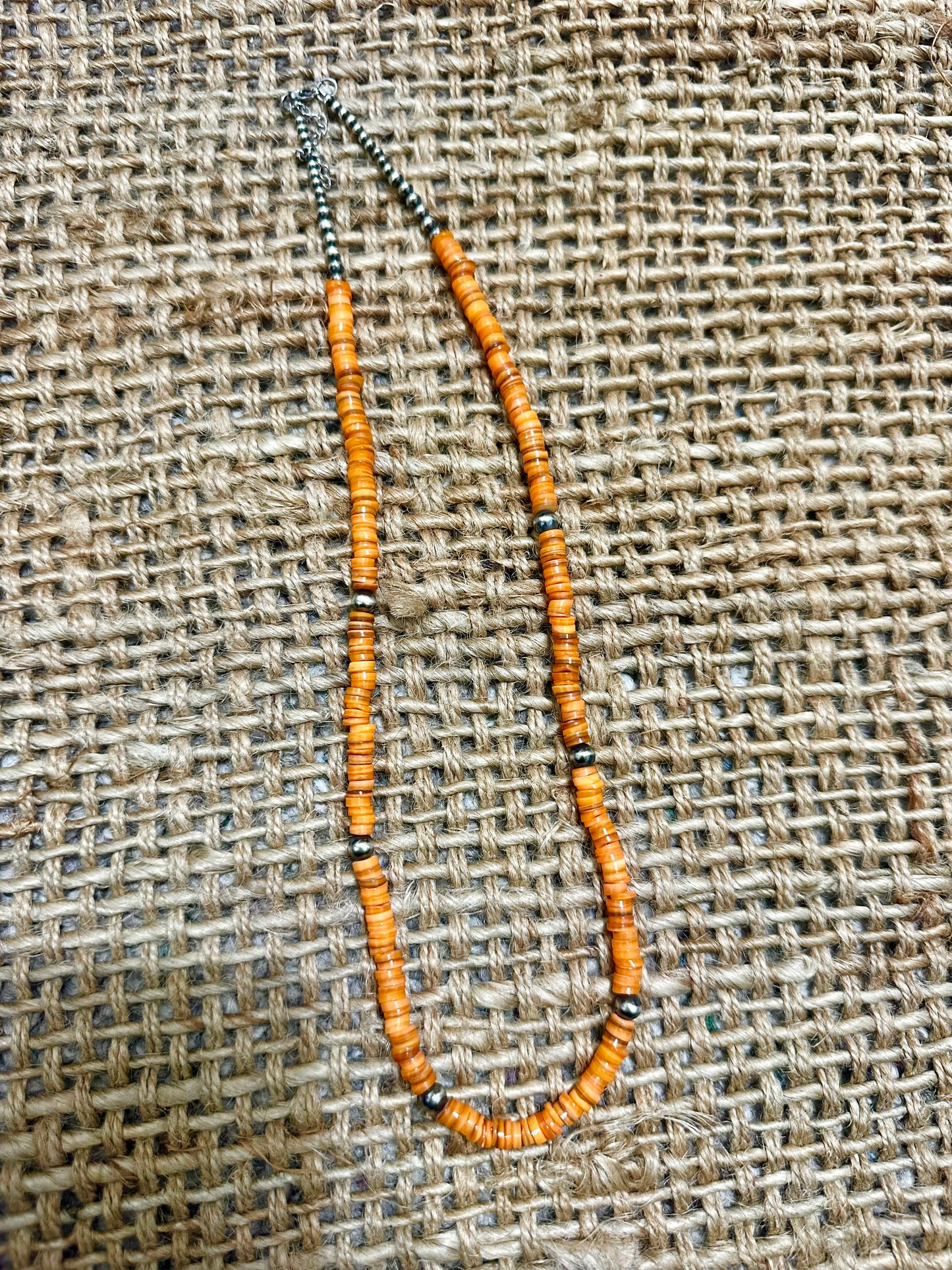 the long orange necklace