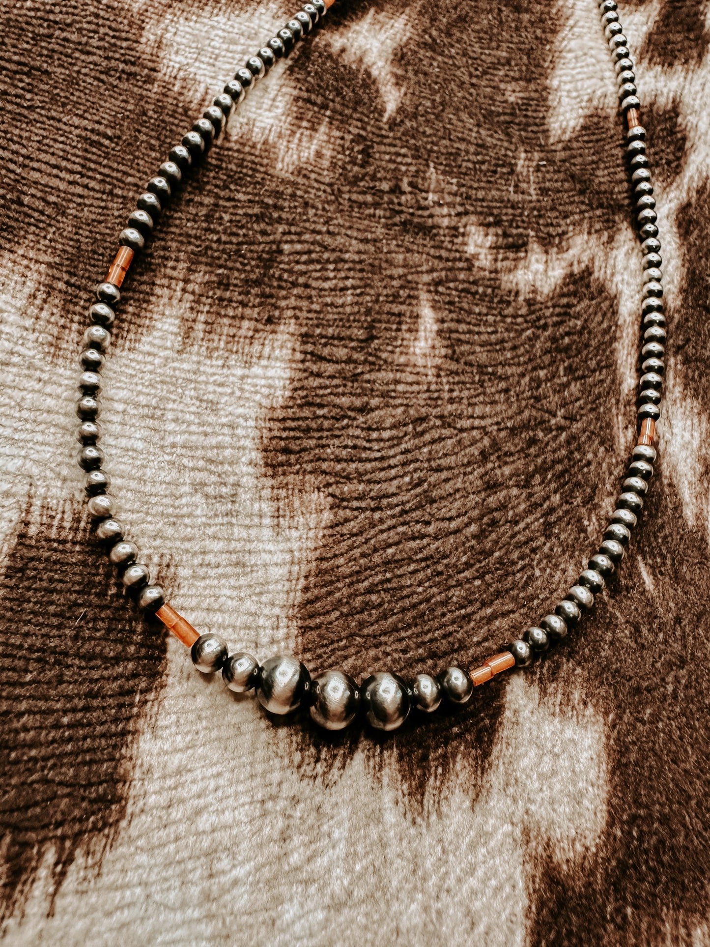the tiny orange necklace