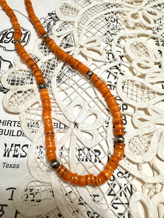 the long orange necklace