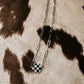 the checked out necklace