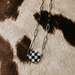 the checked out necklace