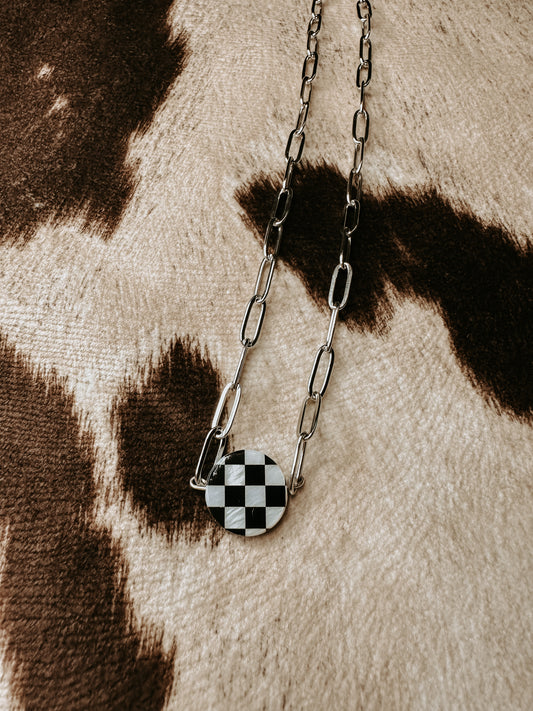 the checked out necklace